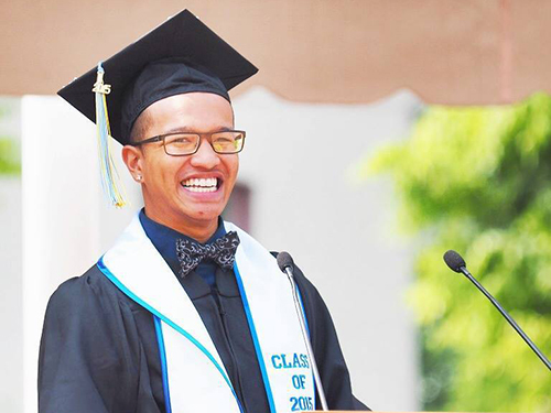 Patton Vo wearing a black graduation cap and gown