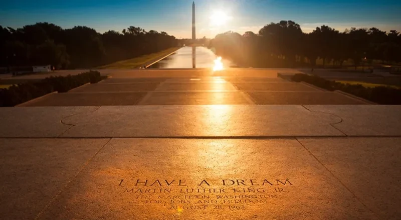 The sun sets behind the Washington monument with a view from the steps of the Lincoln Memorial where Martin Luther King Jr. gave his "I have a dream" speech.