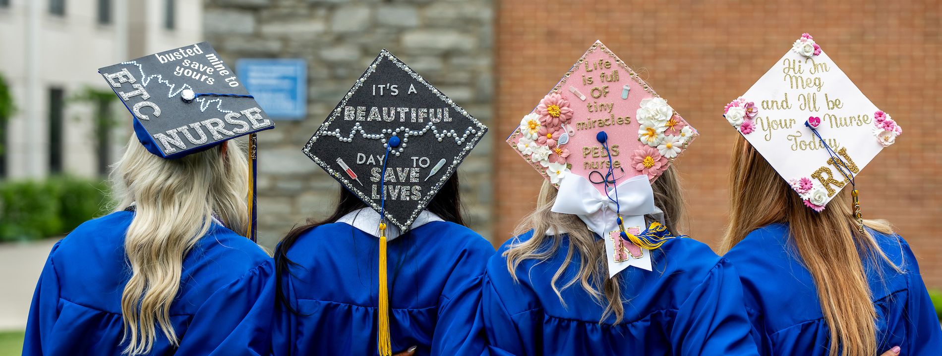 four nursing grad caps at Widener's commencement