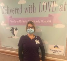 Karen Cook poses for a photo at work on the maternity floor.