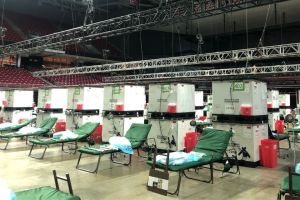 Patient beds line the arena floor in the Liacouras Center.