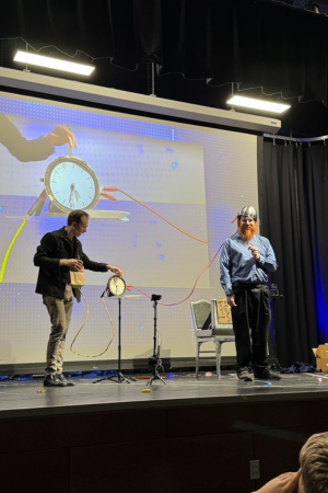 Trigg Watson and an audience member on stage