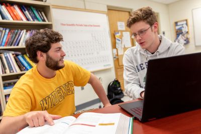 widener students provide advising for academics with laptop