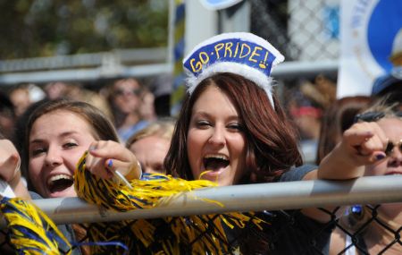 students cheer for widener football at homecoming