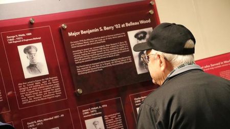 PMC alum reads history display at PMC museum
