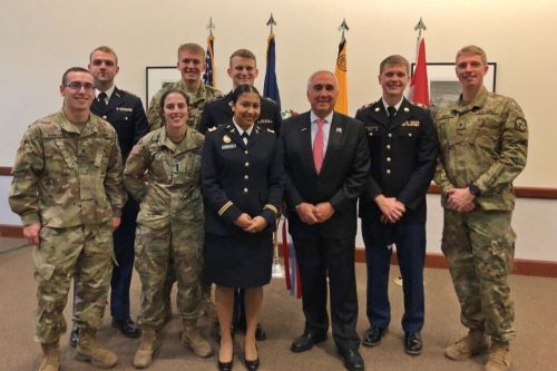 Gen. John Tilelli stands with a group of ROTC cadets at a Veterans Day ceremony.