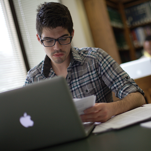Student on laptop in library