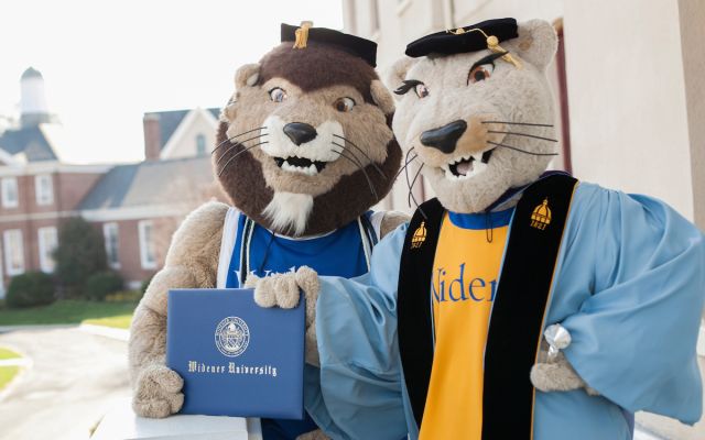 widener mascots in graduation garb holding diploma