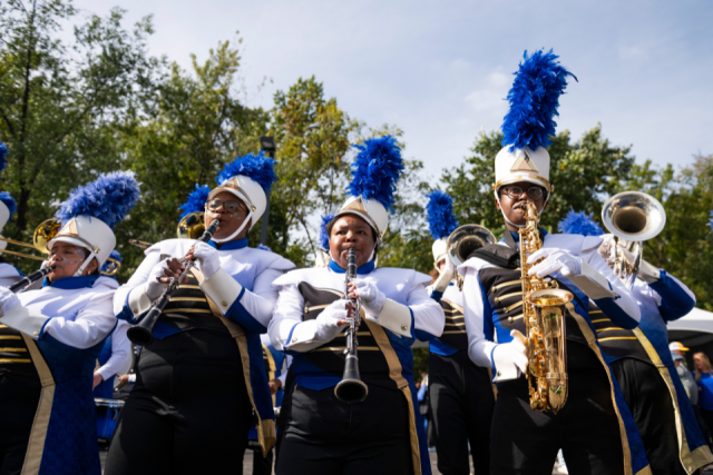 Members of the marching band playing their instruments.